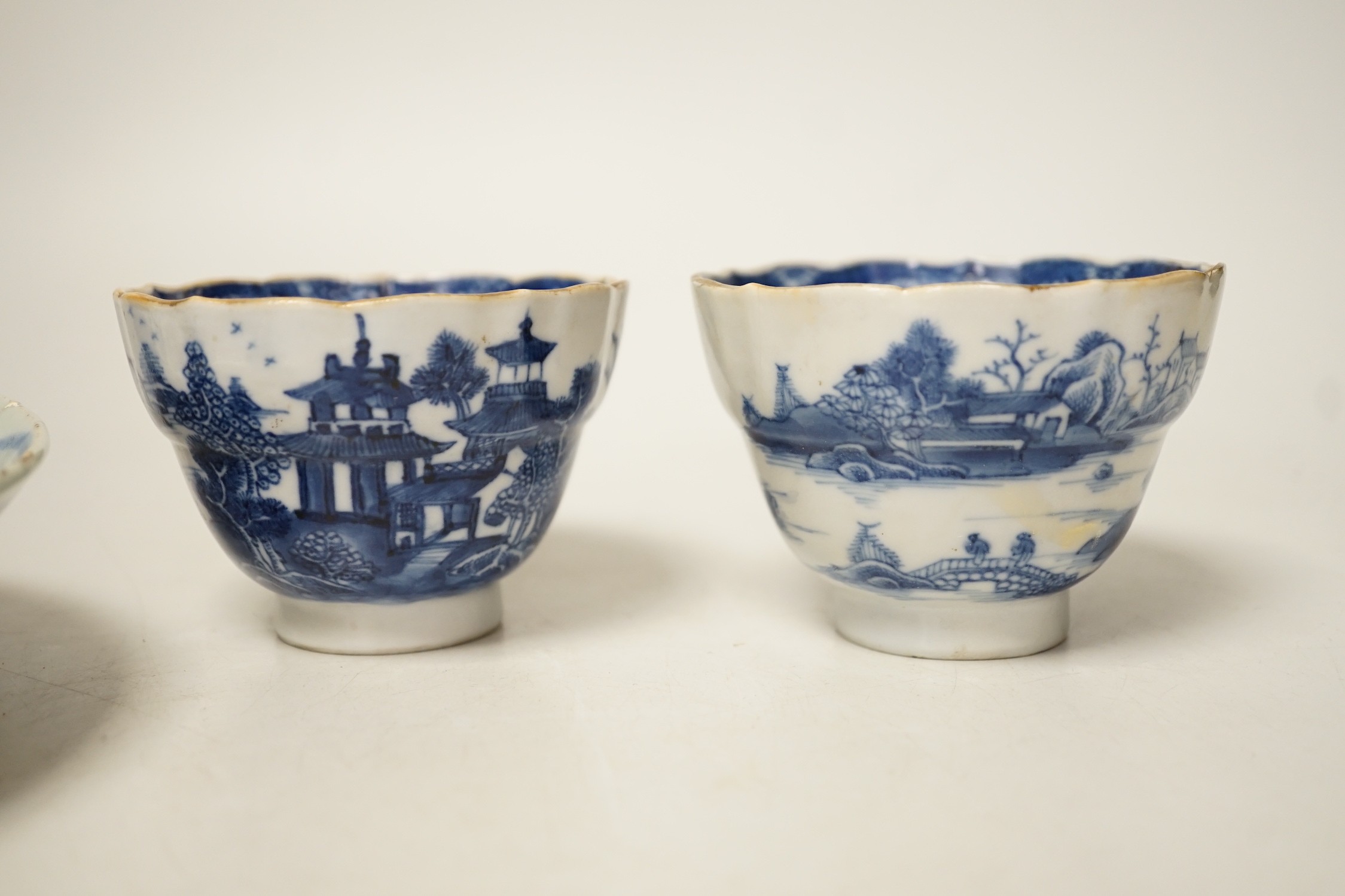Two 19th century Chinese blue and white dishes and two 18th century tea bowls, largest 23cm diameter